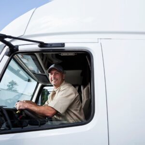 Truck driver smiling out his window